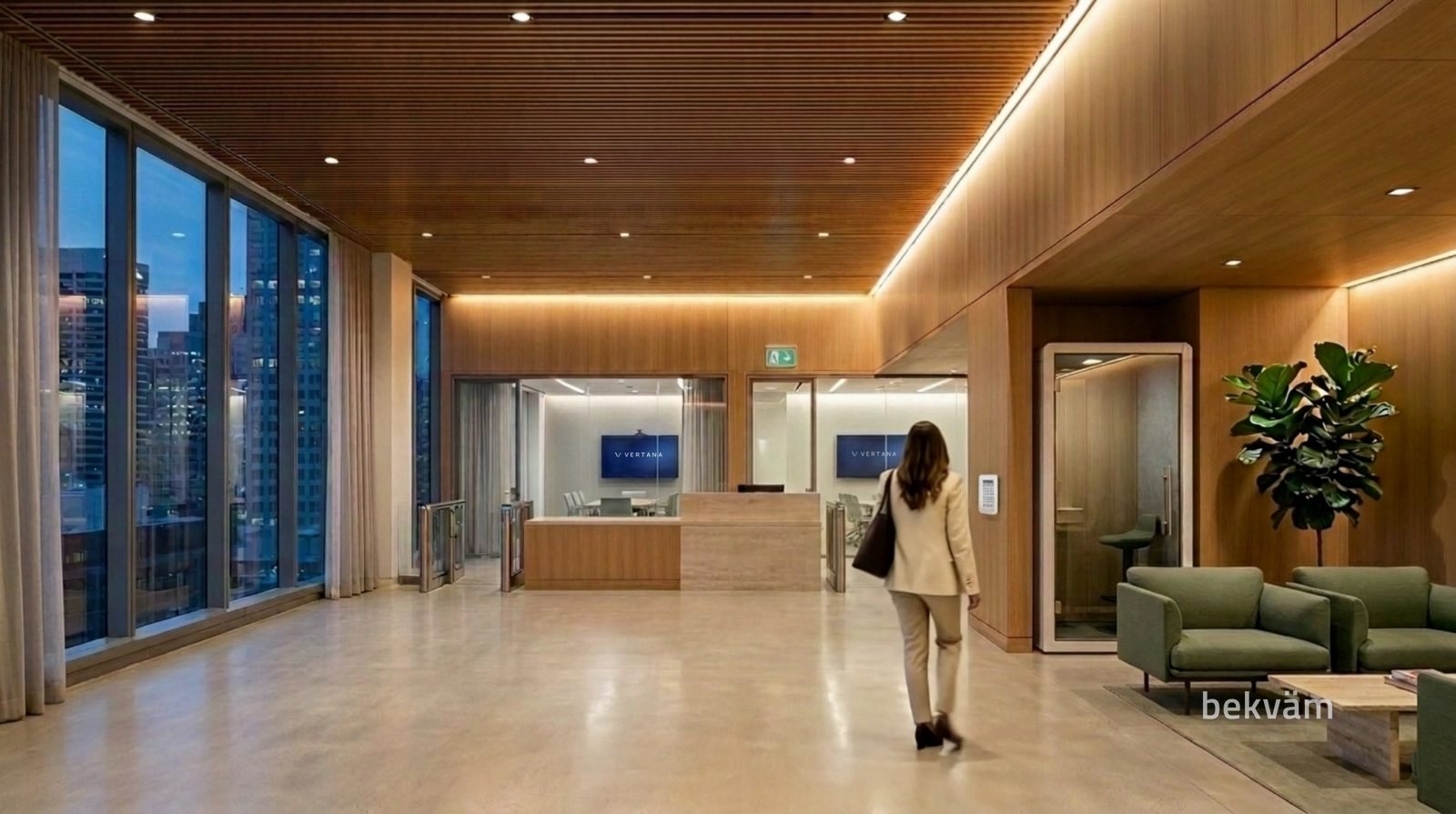 Lobby vazio, com uma funcionária caminhando sozinha